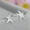 Aretes Estrellas   Blanco/Plateados - Imagen 4